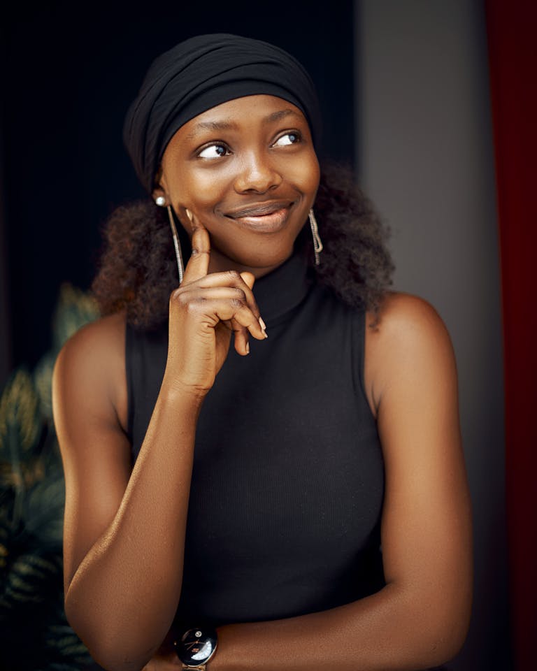 Smiling Woman in Black Tank Top, with high self esteem and confidence.