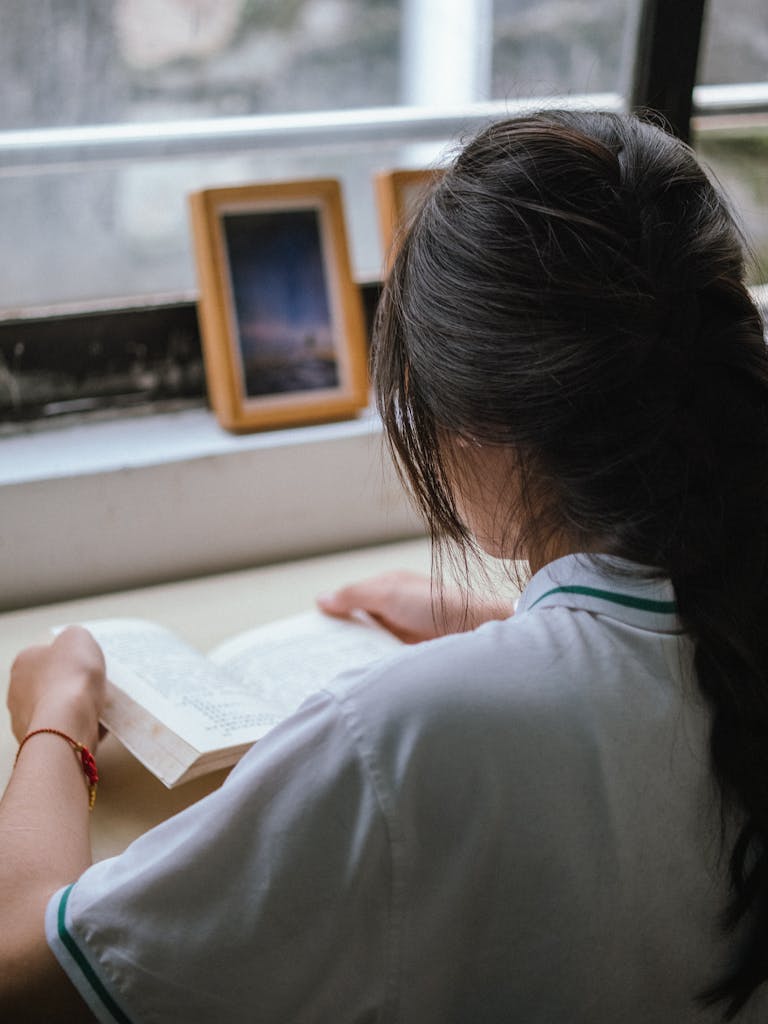 A woman reads a book for her 30 day self improvement challenge.